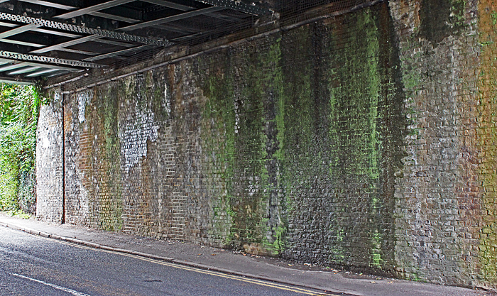 Wall under a railway bridge